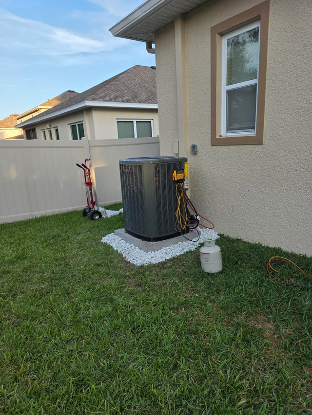 New outdoor air-conditioning system installed beside a home