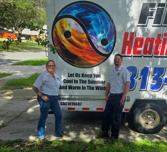 Jason and Jen beside a branded Fire and Ice service truck