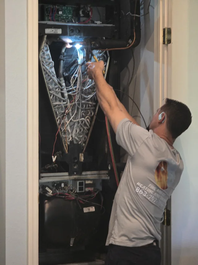 Fire & Ice technician servicing an indoor HVAC system